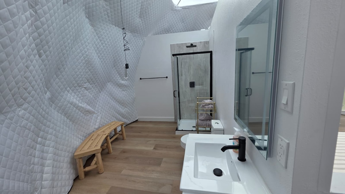 Dome bathroom with shower and bench