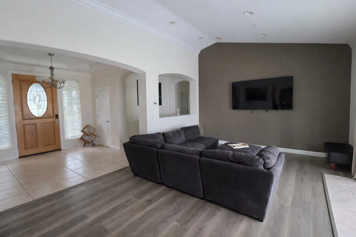 Private house living room with sectional and entryway