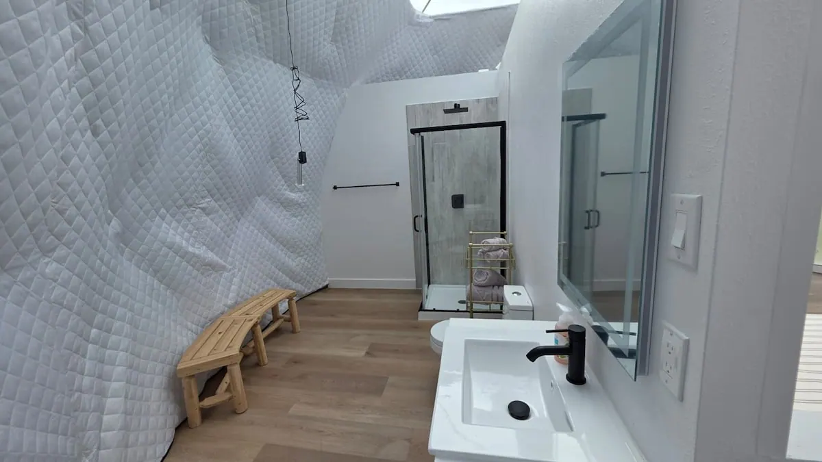 Dome bathroom with shower and bench