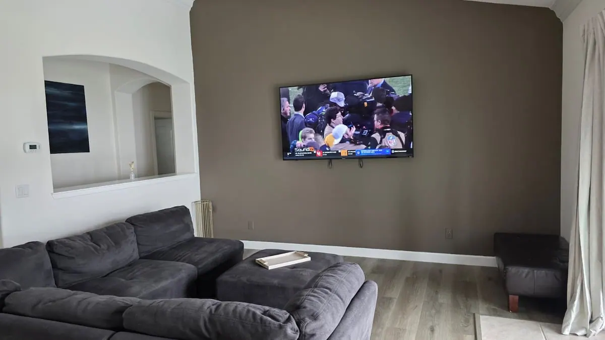 Living room with sectional and large TV