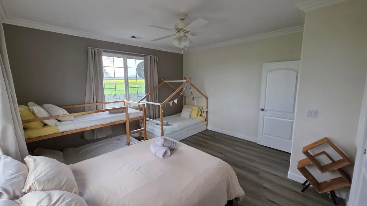Kids bedroom with bunk and house-frame beds